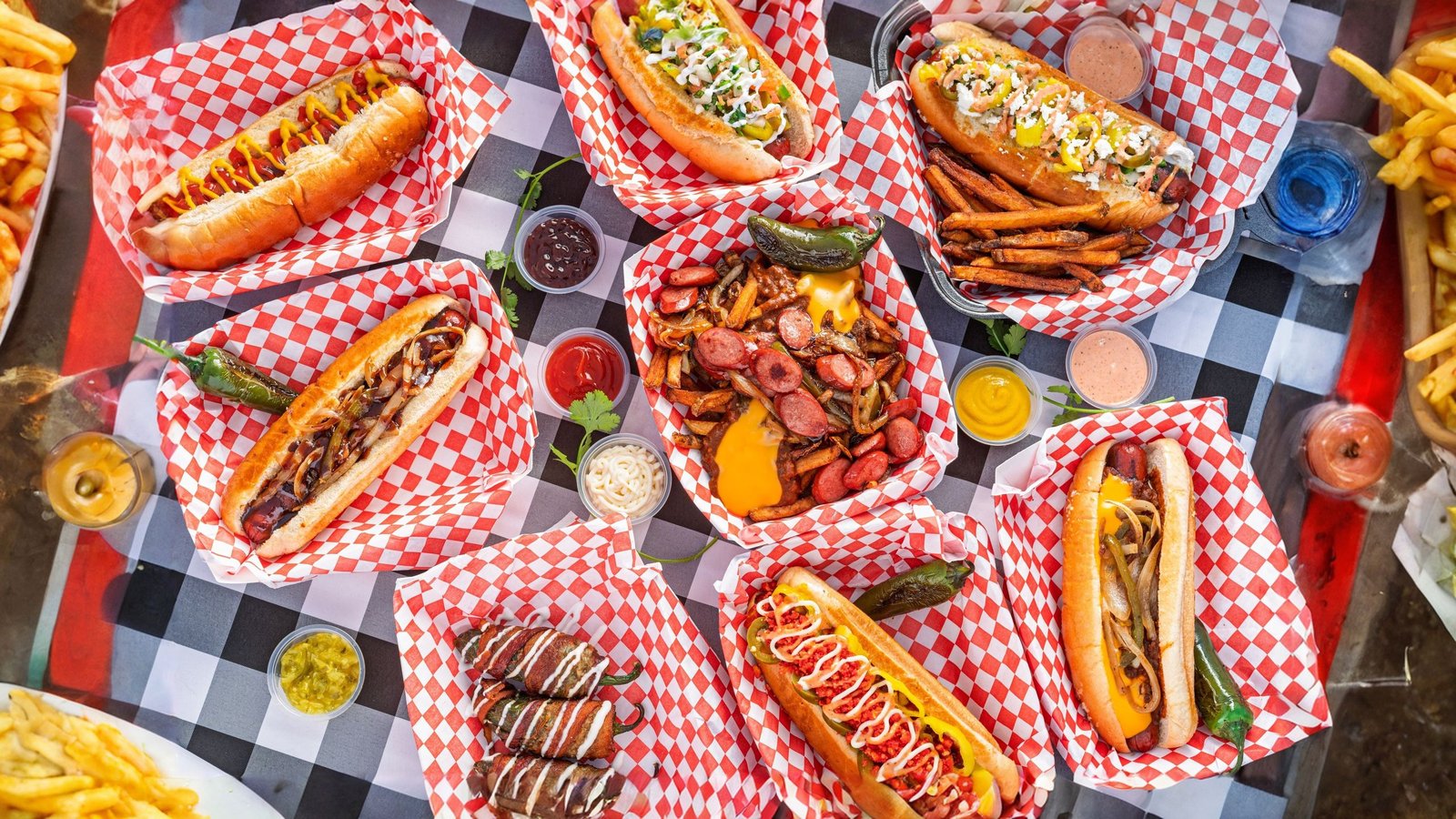 Space City Hotdogs storefront and food spread in Magnolia, Texas
